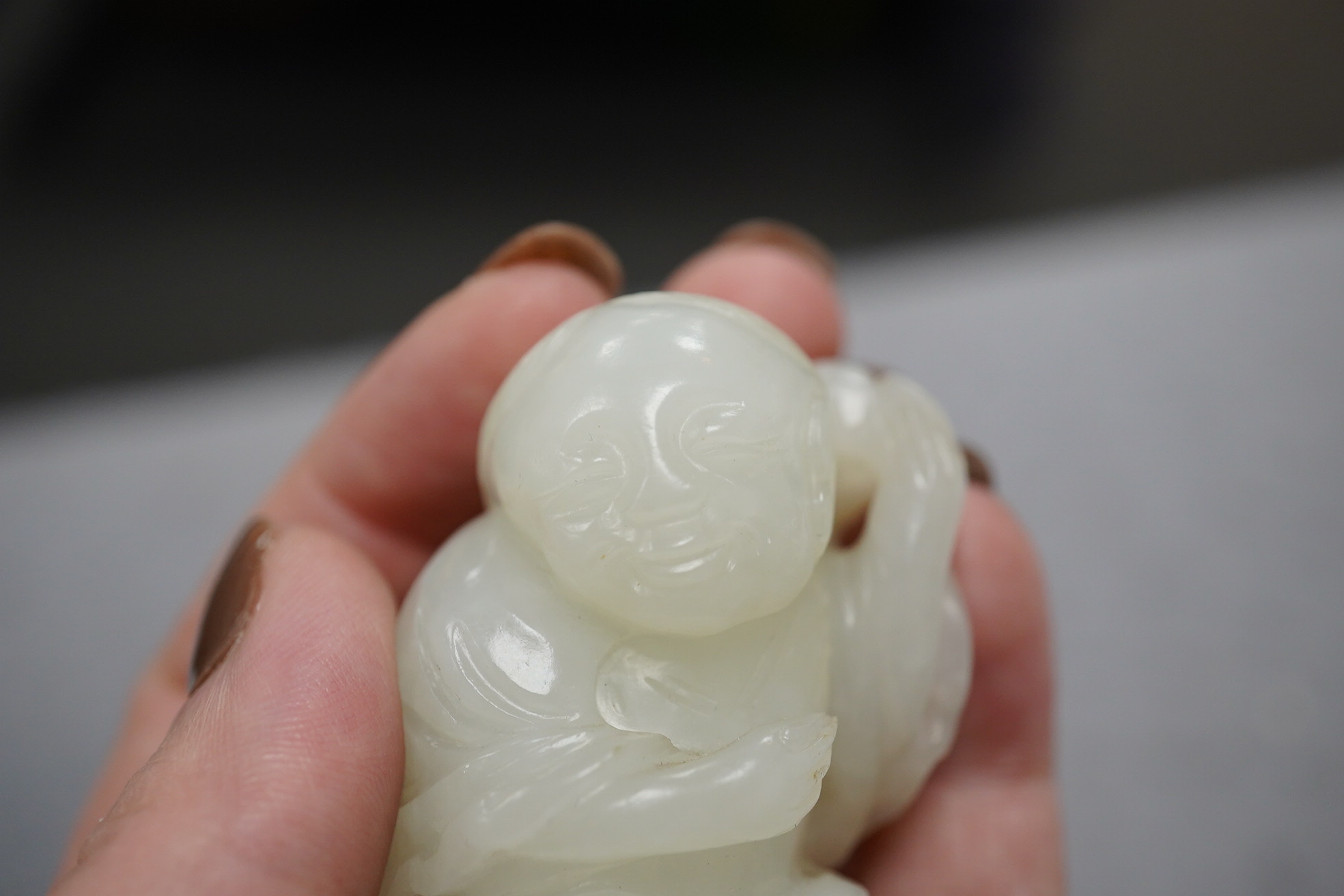 A Chinese white jade figure of Liu Hai, 18th-19th century